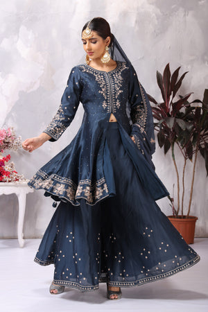 Shop stunning dark blue embroidered sharara suit online in USA with dupatta. Flaunt Indian style at parties and weddings in beautiful designer dresses, salwar suits, Anarkali suits, gowns, palazzo suits from Pure Elegance Indian fashion store in USA.-side