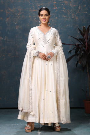 Shop stunning off-white embroidered Anarkali suit online in USA with dupatta. Flaunt Indian style at parties and weddings in beautiful designer dresses, salwar suits, Anarkali suits, gowns, palazzo suits from Pure Elegance Indian fashion store in USA.-front