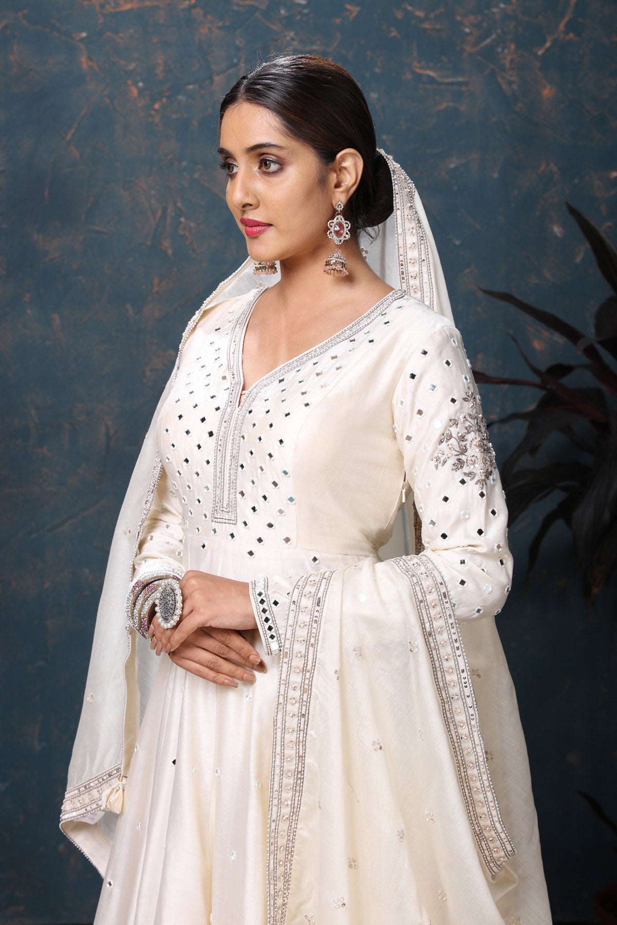 Shop stunning off-white embroidered Anarkali suit online in USA with dupatta. Flaunt Indian style at parties and weddings in beautiful designer dresses, salwar suits, Anarkali suits, gowns, palazzo suits from Pure Elegance Indian fashion store in USA.-closeup