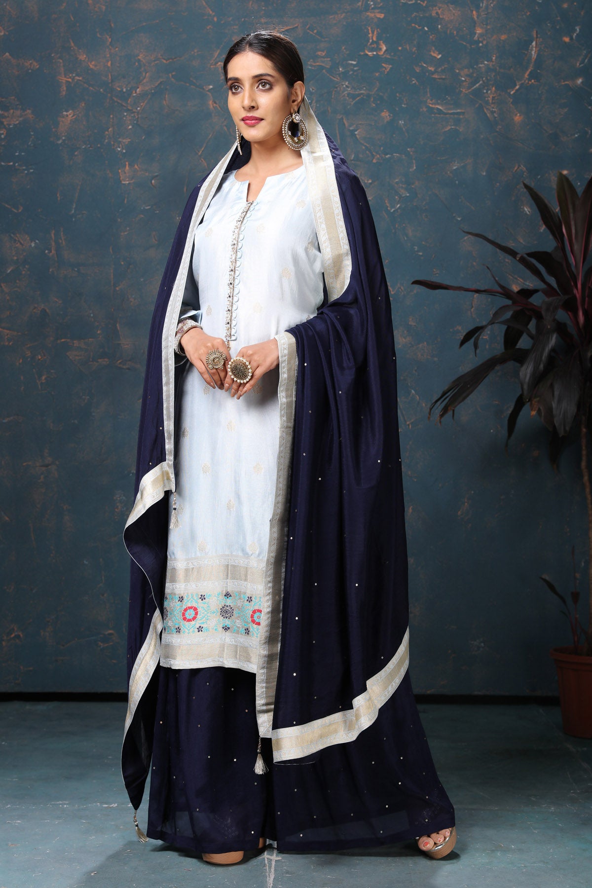 Shop beautiful powder blue embroidered suit online in USA with navy blue dupatta. Flaunt Indian style at parties and weddings in beautiful designer dresses, salwar suits, Anarkali suits, gowns, palazzo suits from Pure Elegance Indian fashion store in USA.-side