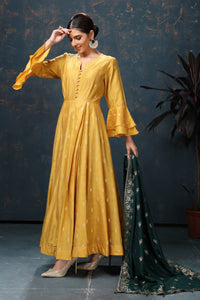 Shop stunning yellow embroidered chanderi silk Anarkali suit online in USA with green dupatta. Flaunt Indian style at parties and weddings in beautiful designer dresses, salwar suits, Anarkali suits, gowns, palazzo suits from Pure Elegance Indian fashion store in USA.-full view