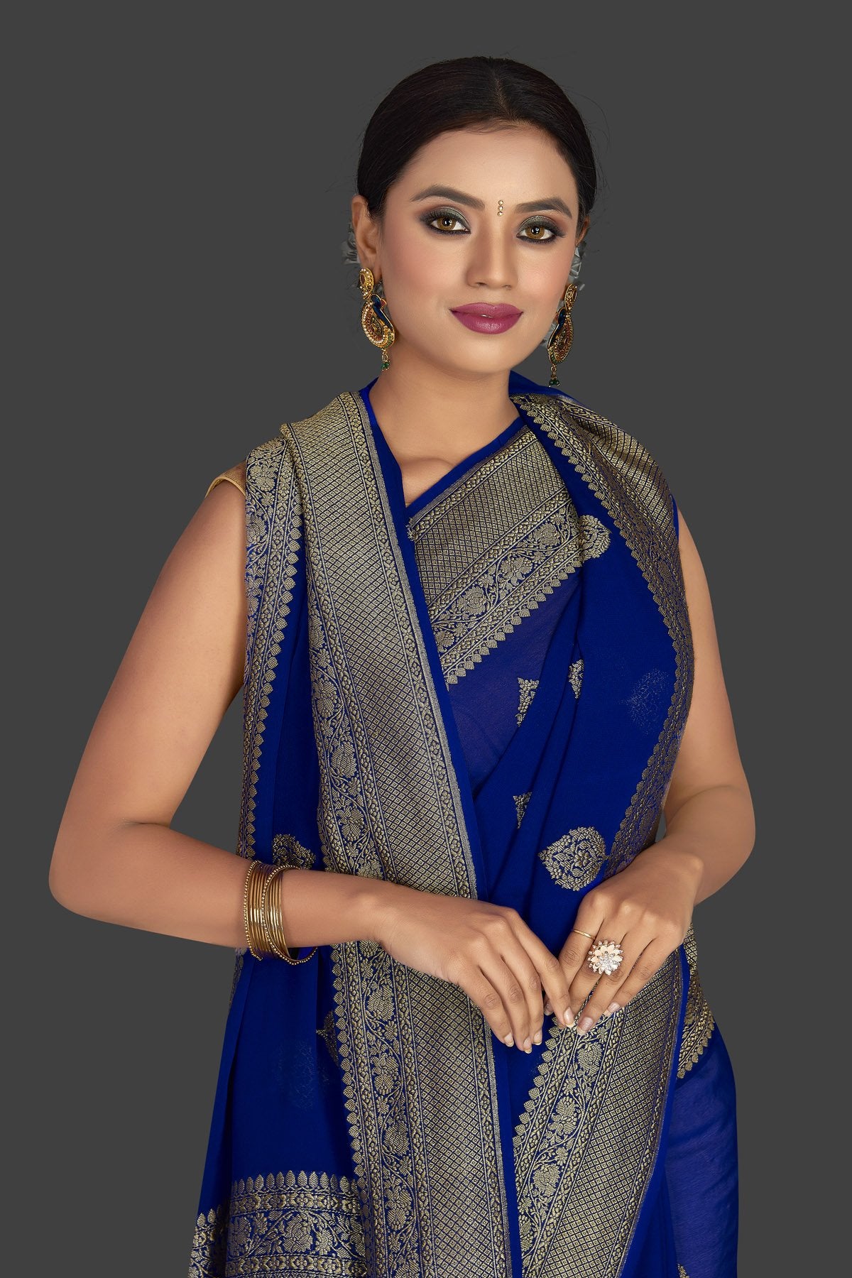 Buy gorgeous indigo blue georgette Benarasi sari online in USA with zari border. Radiate elegance with georgette sarees, Banarasi sarees, handwoven sarees from Pure Elegance Indian fashion boutique in USA. We bring a especially curated collection of ethnic sarees for Indian women in USA under one roof!-closeup