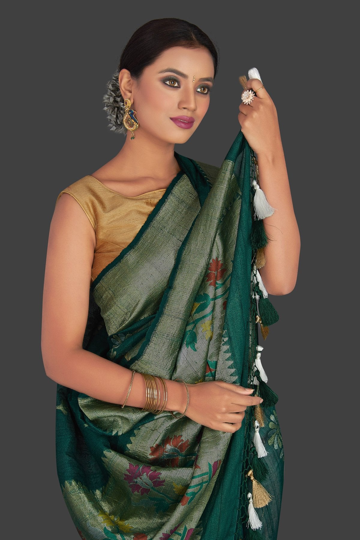 Buy elegant dark green tassar georgette Banarsi saree online in USA with flower buta. Radiate elegance with georgette sarees, Banarasi sarees, handwoven sarees from Pure Elegance Indian fashion boutique in USA. We bring a especially curated collection of ethnic sarees for Indian women in USA under one roof!-closeup
